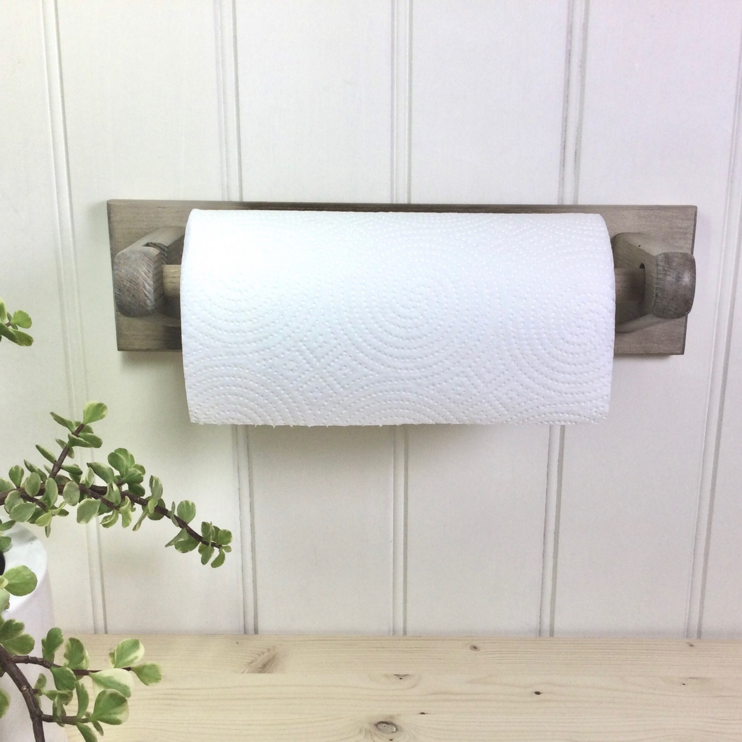 Handmade wall mounted wooden kitchen roll holder in a Driftwood colour