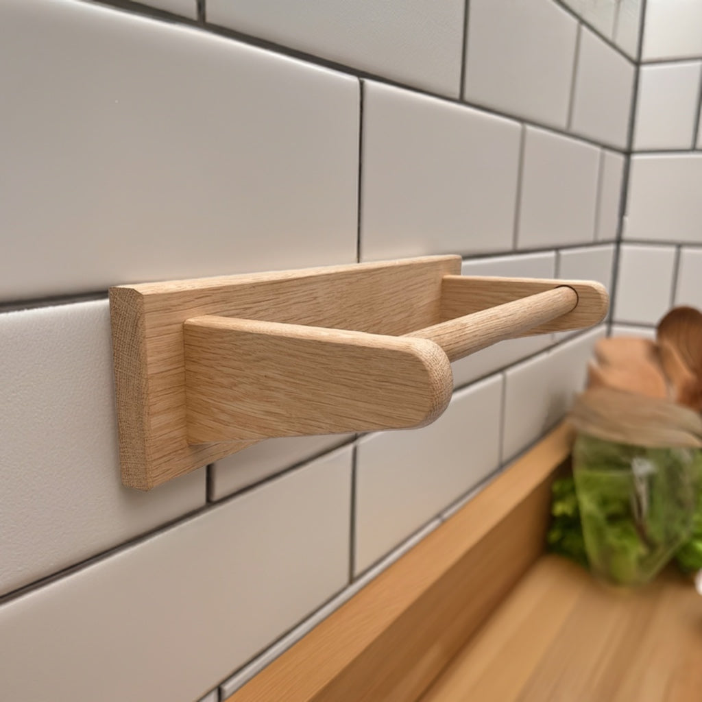 Wall mounted kitchen roll holder