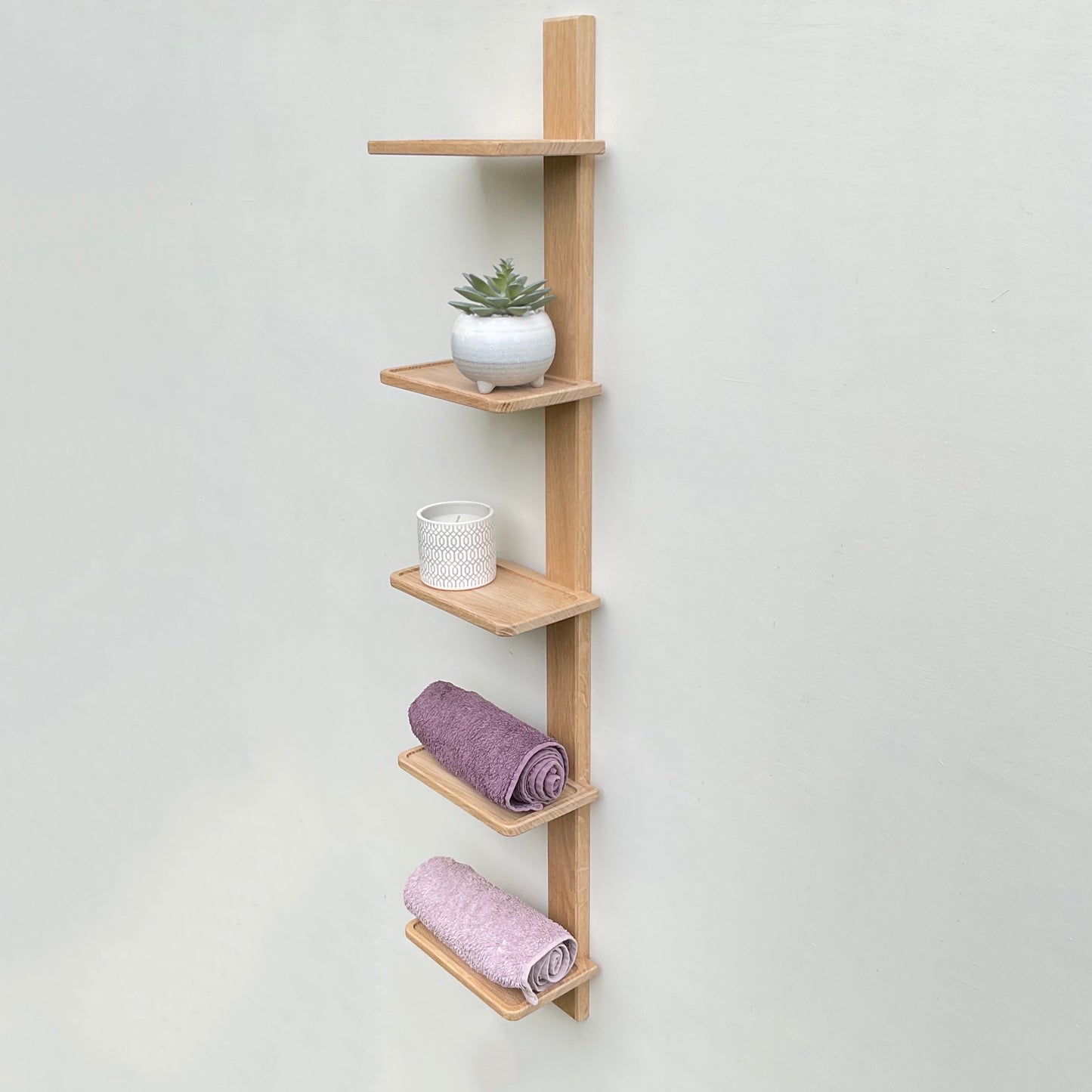 Tall vertical oak bathroom or cloakroom shelf unit