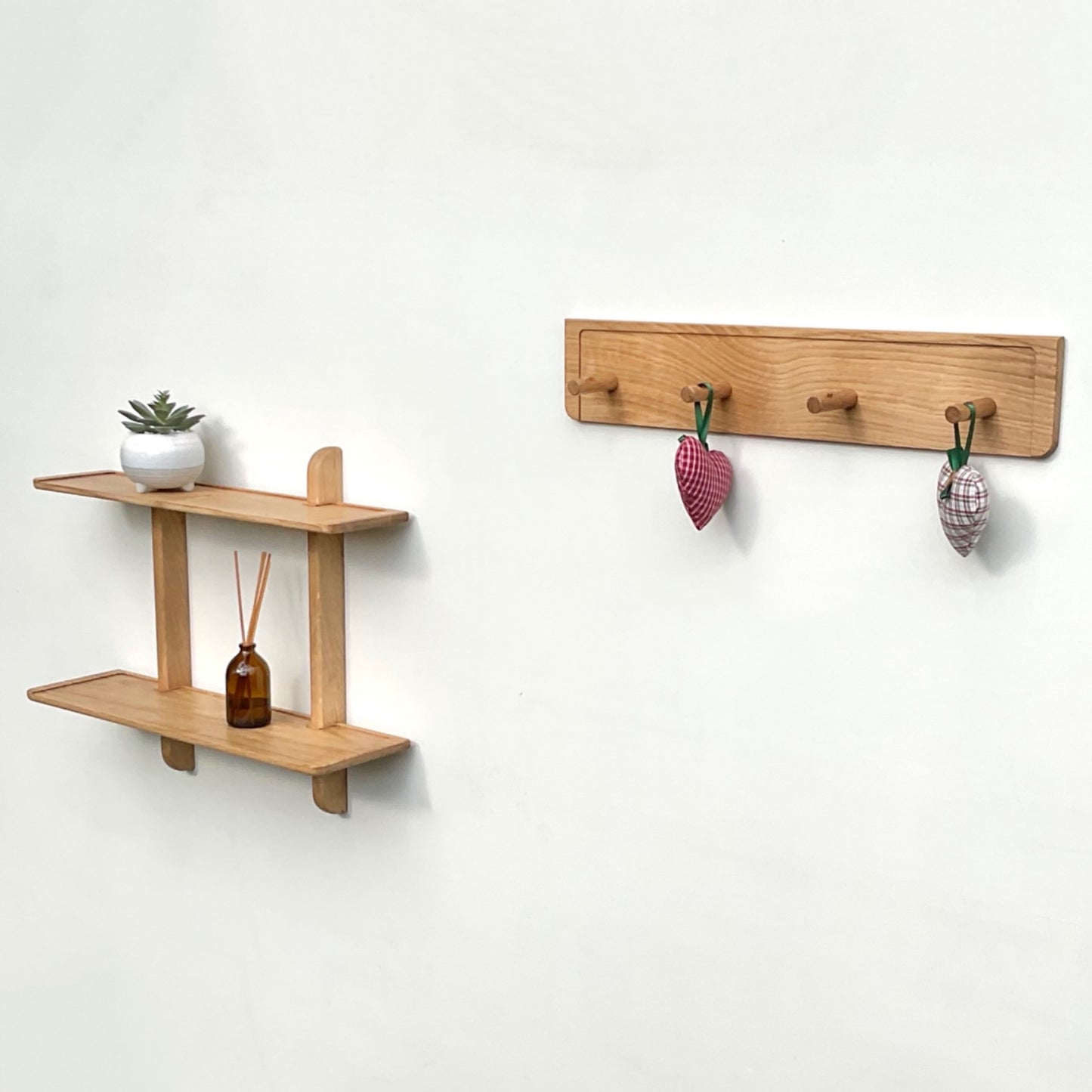 Double oak wall shelf with matching peg rack for coats and hats
