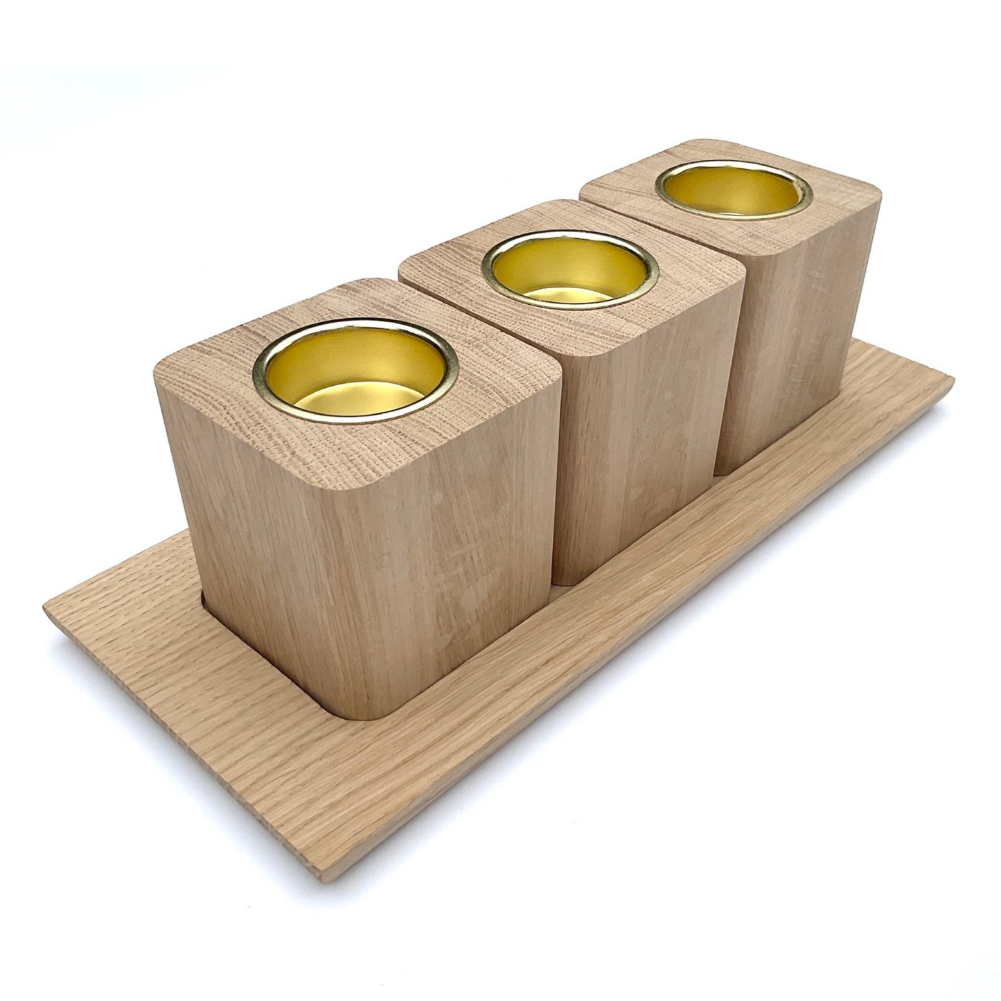 Set of three oak tea light holders with brass coloured inserts and oak tray