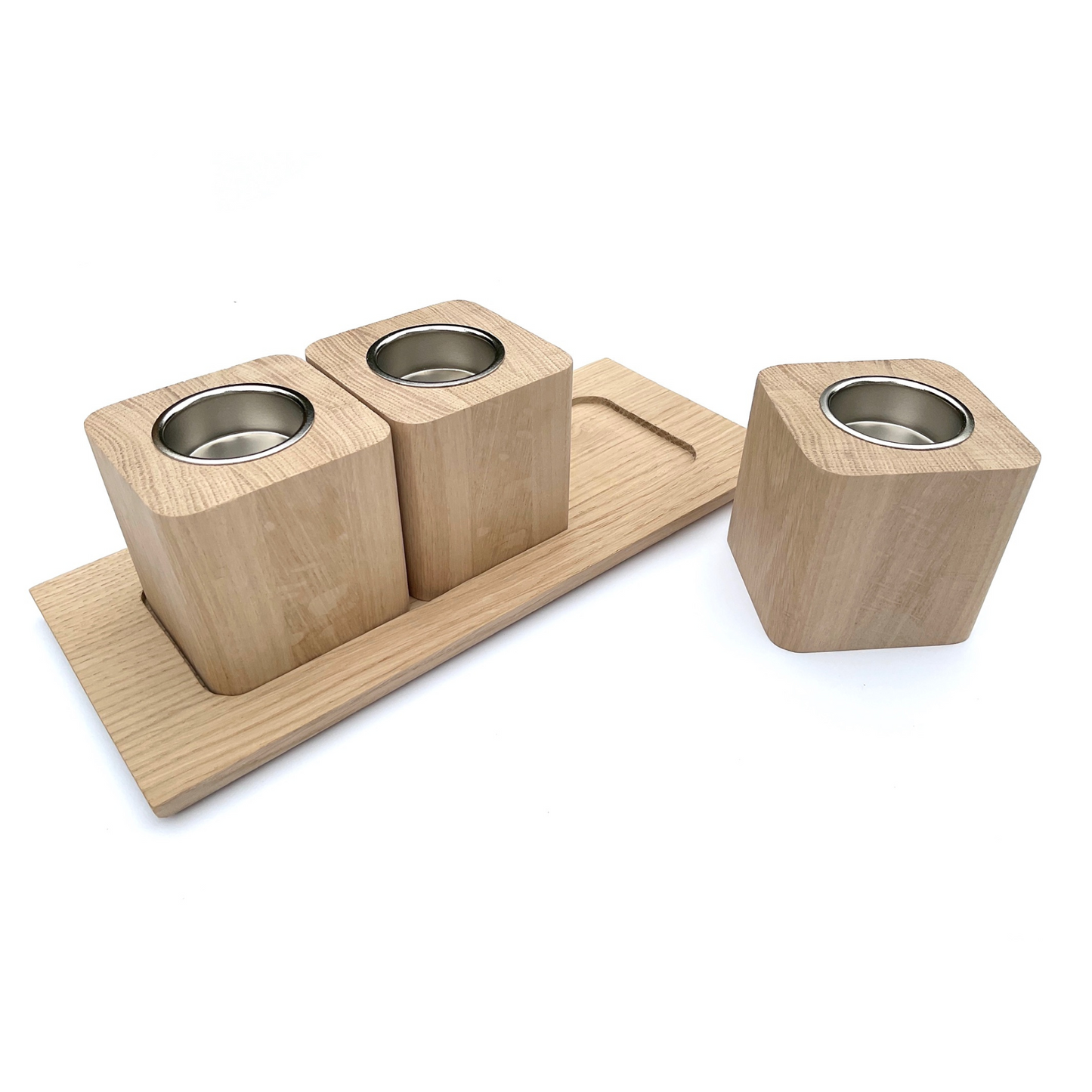 Set of three oak tea light holders with nickel coloured inserts and oak tray