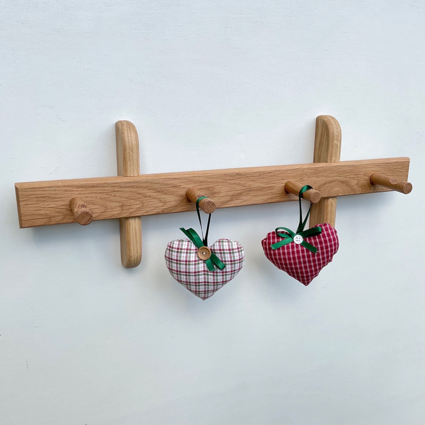 Wooden wall mounted peg rail