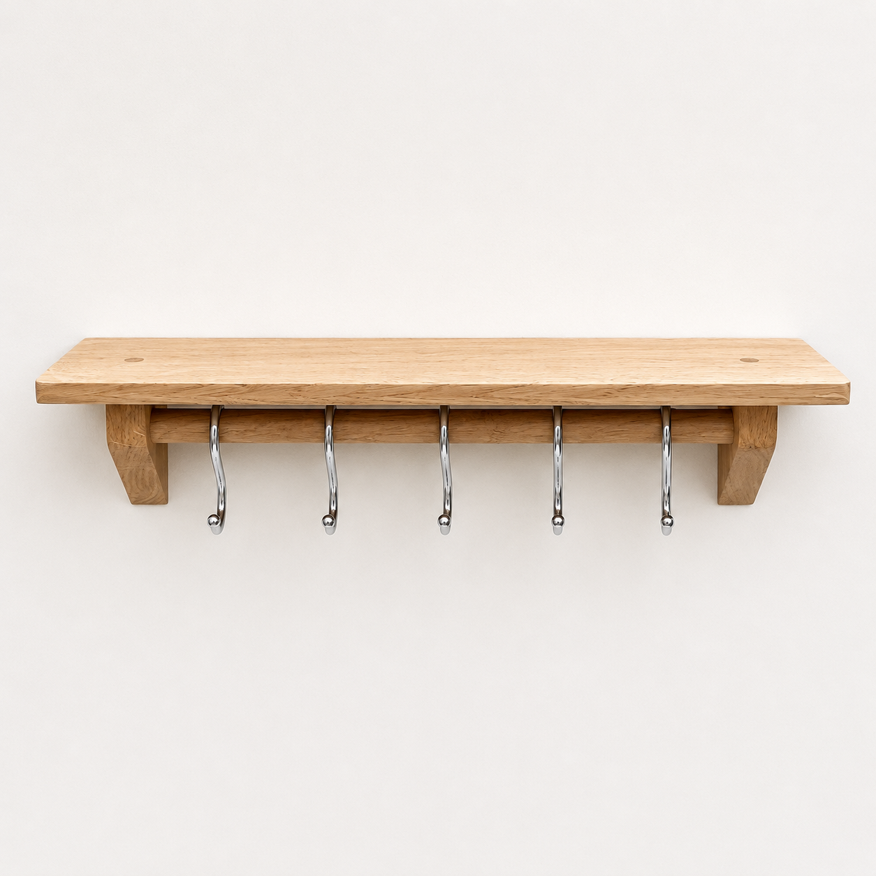 Oak kitchen shelf with utensil rail and chrome utensil hooks