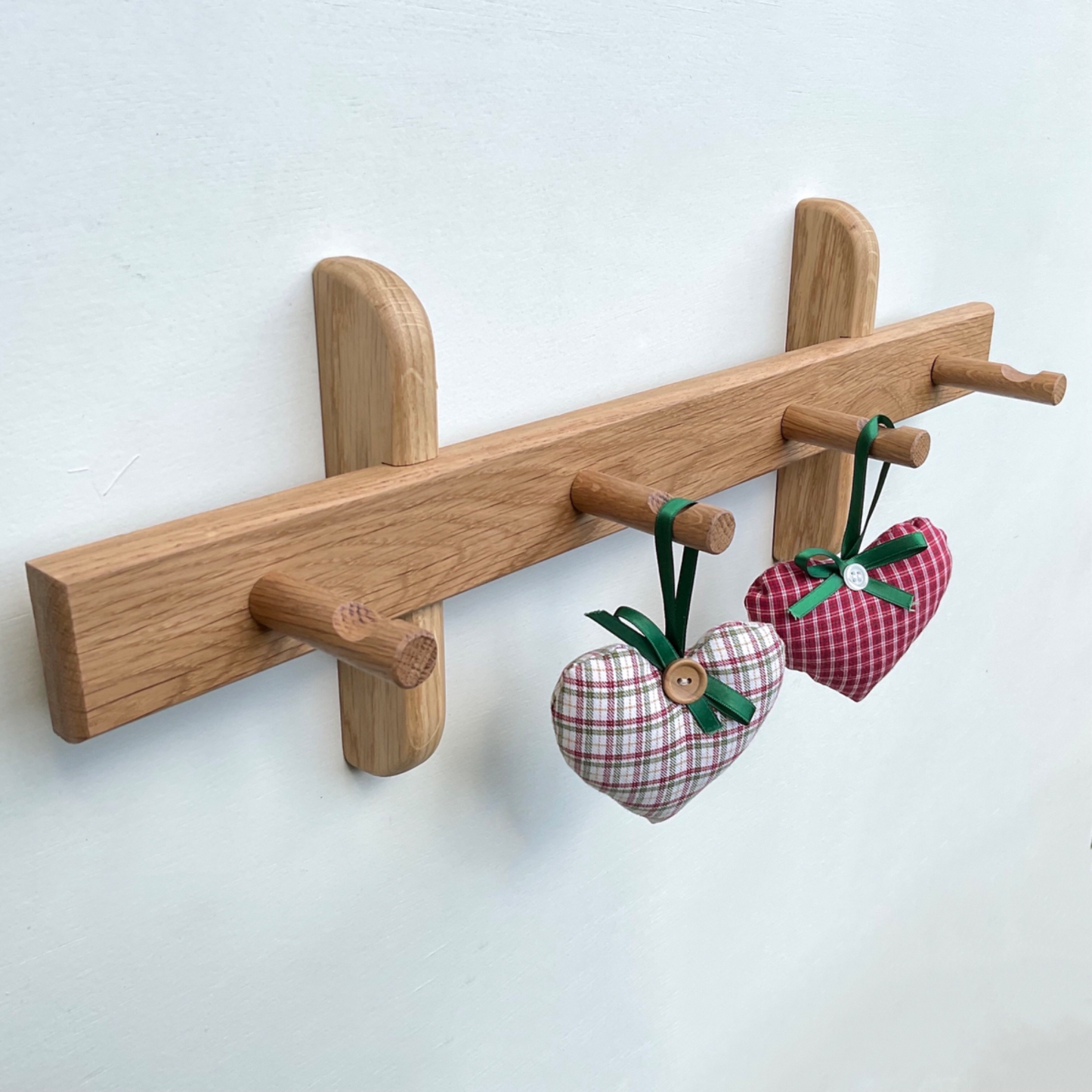 Oak peg rail for coats, hats and scarfs