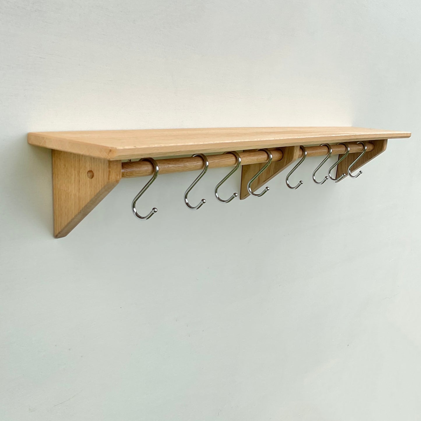 Oak kitchen utensil rail and shelf with chrome utensil hooks