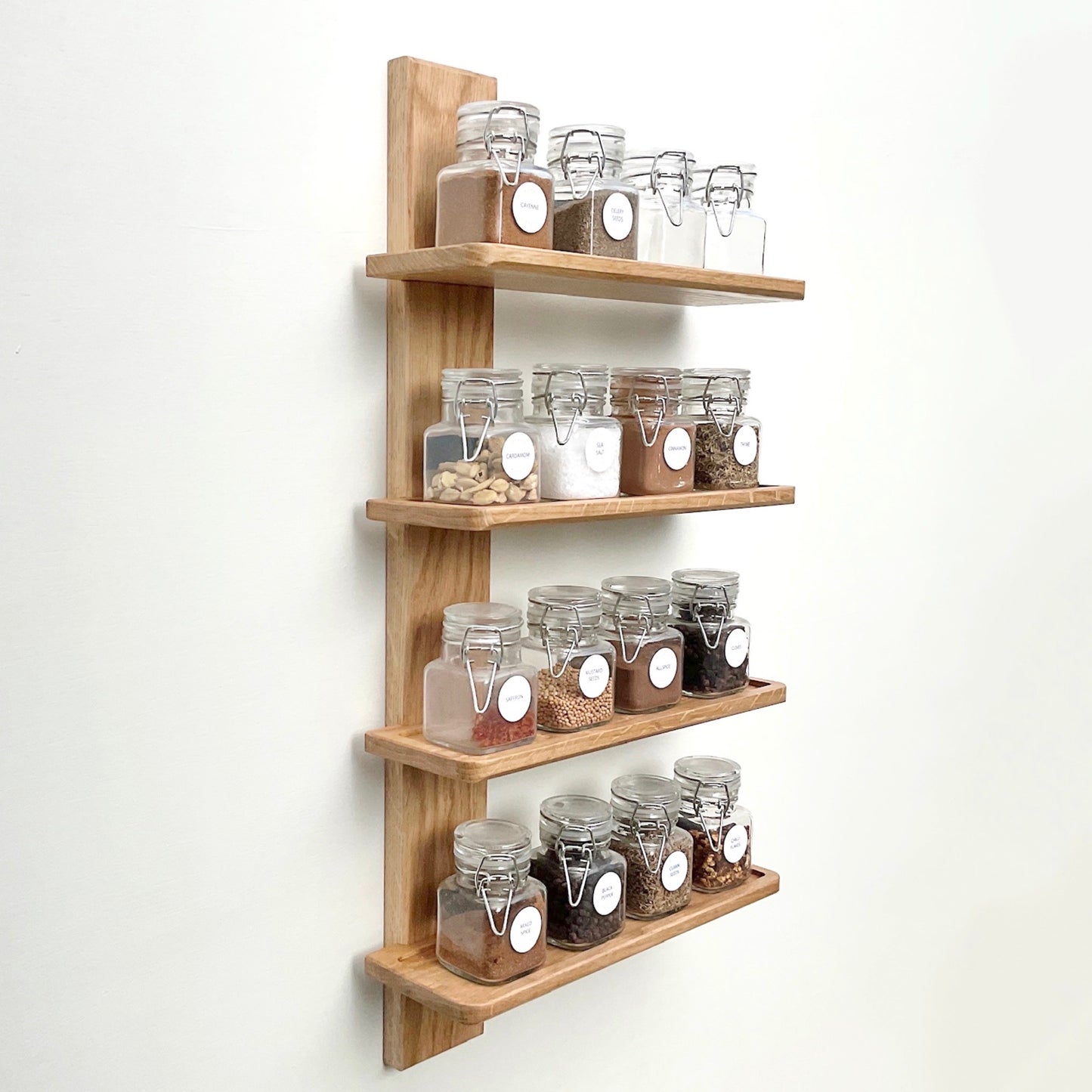 Wall mounted oak spice rack with square clip top spice jars