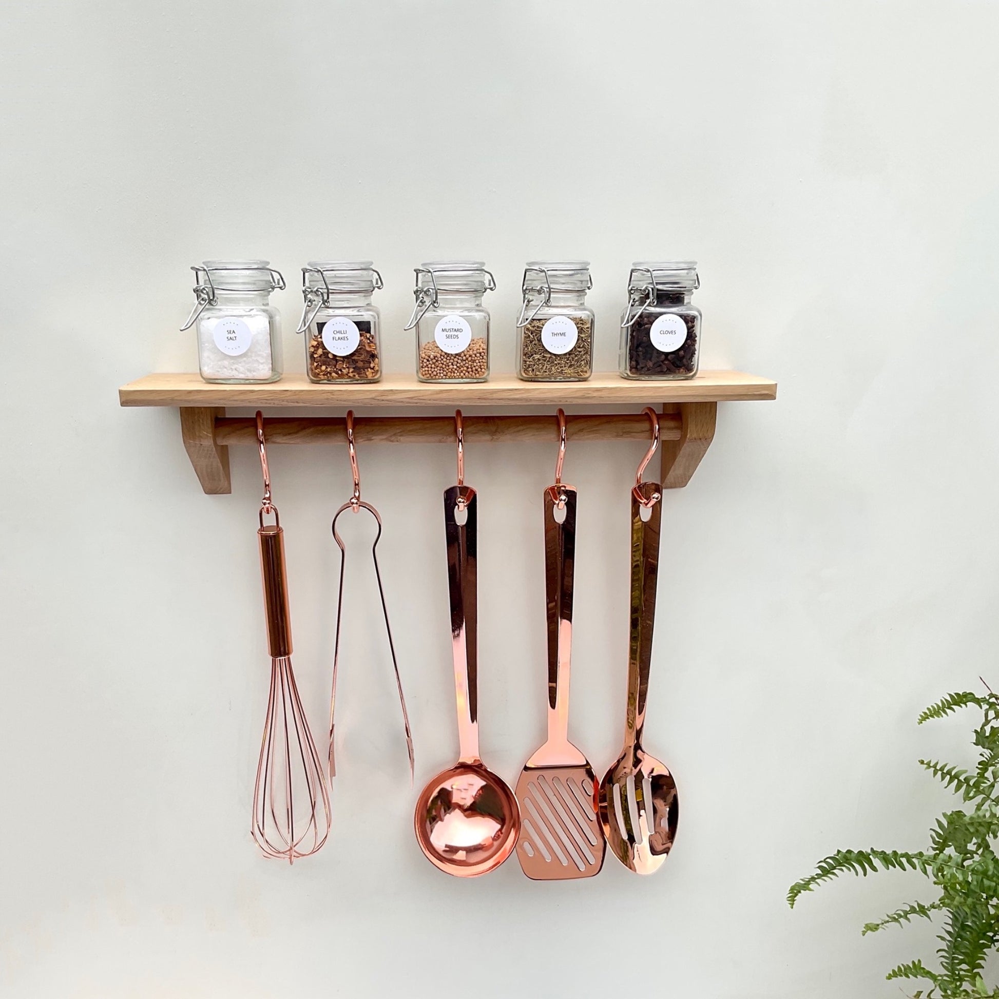 Wall mounted kitchen utensil rail with oak shelf