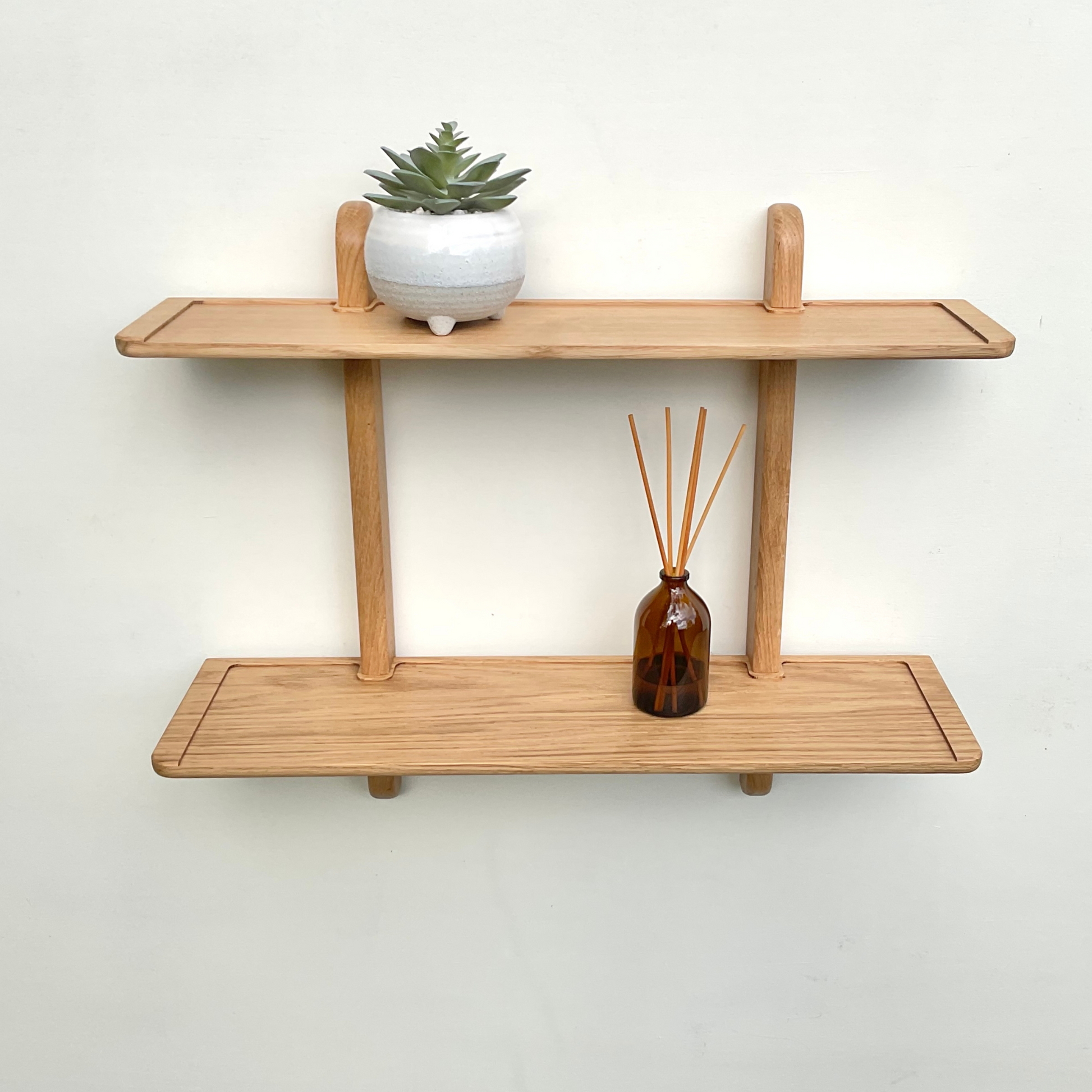 Solid oak double wall shelf. Ideal for displaying your favourite decorative items.