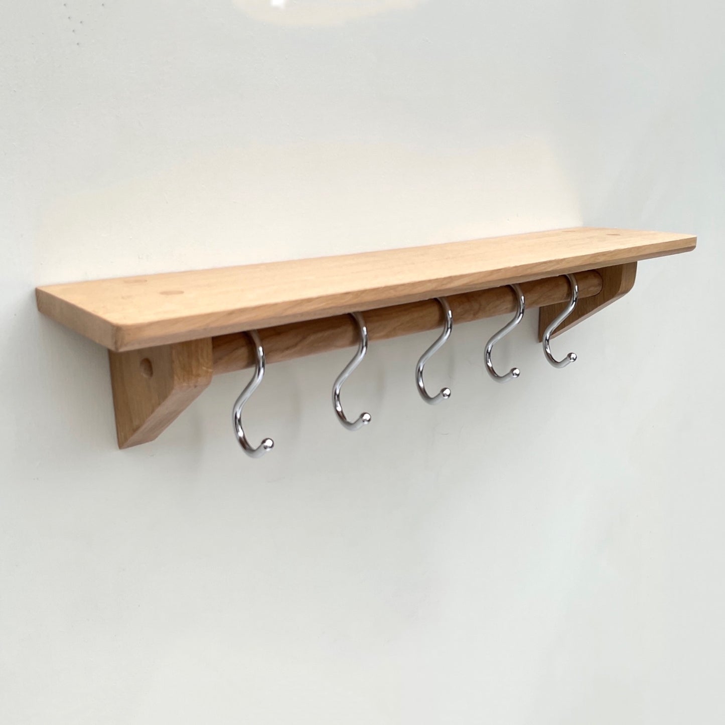 Oak kitchen utensil rail with shelf and chrome utensil hooks