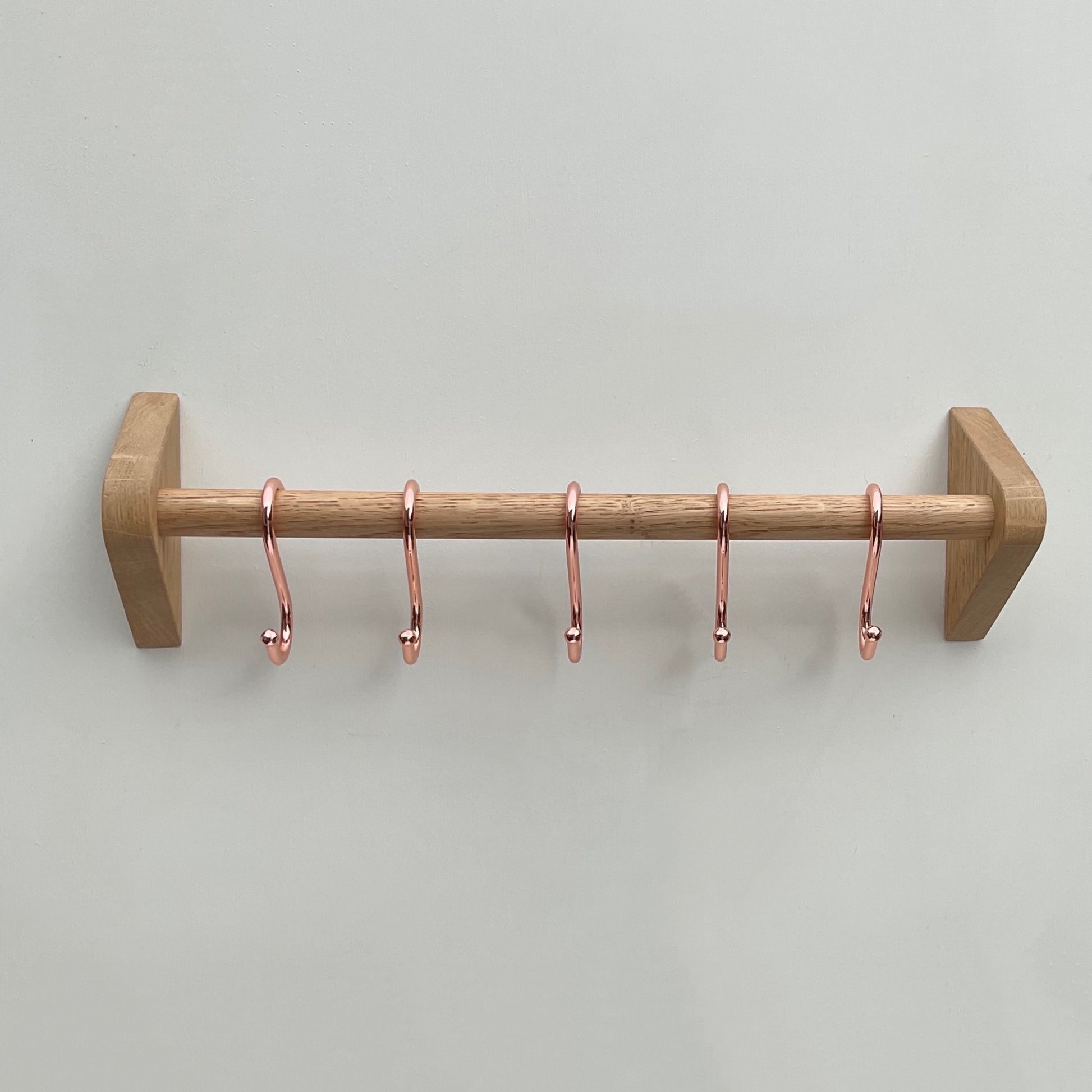 Handmade kitchen utensil rack with copper utensil hooks