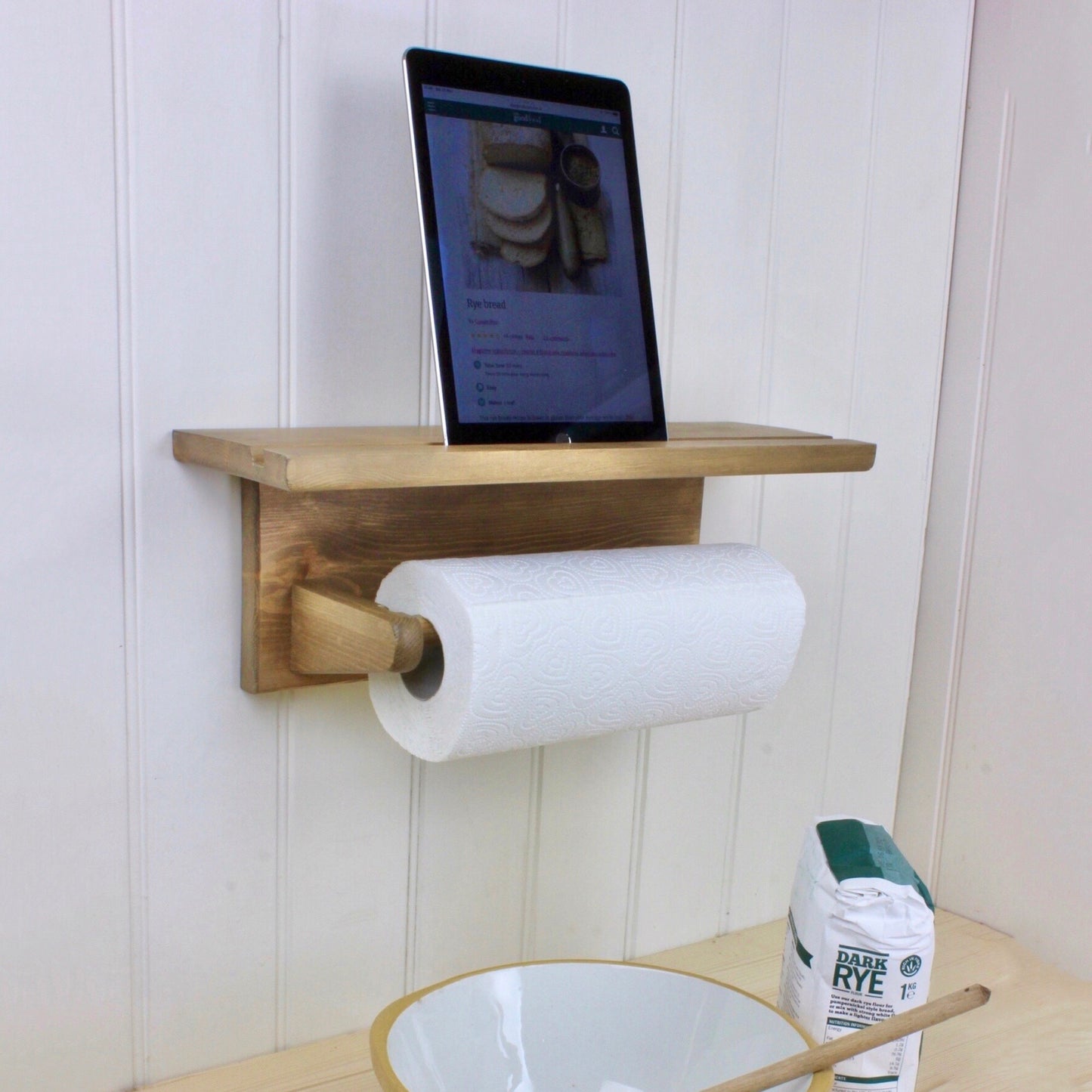 Wall mounted kitchen roll holder with iPad shelf