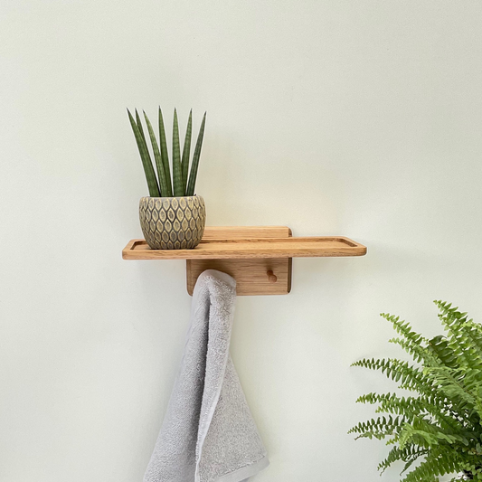 Bathroom shelf with shaker style towel pegs in oak