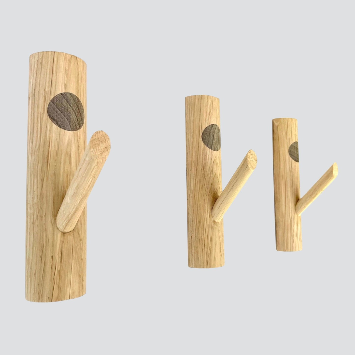 Oak wall hooks with walnut wood inset